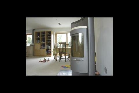 A wood-burning stove in the main living space should meet the small heating requirements.